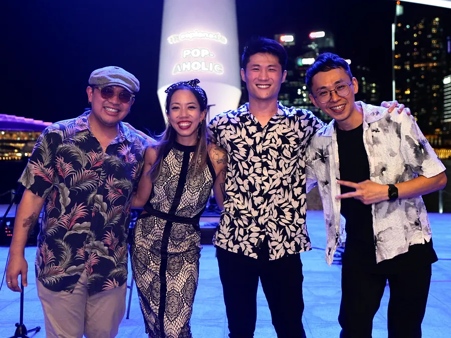The quartet smiling after the show at the Esplanade, Marina Bay behind
